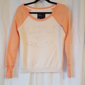 Small orange and white sweater